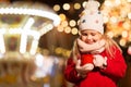 Happy girl with cup of tea at christmas market Royalty Free Stock Photo