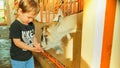 Holidays in the country - little boy feeds a goat. baby 2 years old