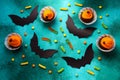 Holidays, decorations and party concept - Halloween cupcakes and candies on green background Royalty Free Stock Photo
