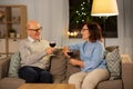 Happy senior couple with glasses of red wine Royalty Free Stock Photo