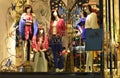 In holidays 4 fashion Mannequins in clothing shop window Royalty Free Stock Photo