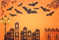 Holidays Halloween concept. haunted alley with vintage fence, street lamp trees and bats over orange background. Top view, flat Royalty Free Stock Photo