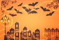 Holidays Halloween concept. haunted alley with vintage fence, street lamp trees and bats over orange background. Top view, flat Royalty Free Stock Photo