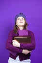 Holidays Ideas. Portrait of Dreaming Winsome Caucasian Female in Seasonal Warm Clothing Posing with Big Wrapped Present Gift Boxe