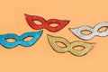 Holidays image of mardi gras masquarade sequins masks over yellow background. view from above