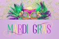 Holidays image of mardi gras masquarade venetian mask over purple background. view from above