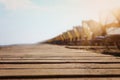 Holidays image of wooden deck at tropical beach chairs under umbrellas. Summer travel and vacation concept Royalty Free Stock Photo