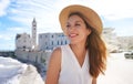 Holidays in Italy. Portrait of smiling relaxed woman on Trani seafront, Apulia, Italy Royalty Free Stock Photo