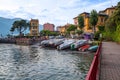 Holidays in Italy - a view of the most   beautiful lake in Italy, Varenna, Lago di Como. Pier in background Royalty Free Stock Photo