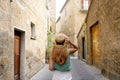 Holidays in Italy. Young woman visiting historic medieval town of Orvieto, Umbria, Italy Royalty Free Stock Photo