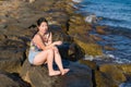 Holidays lifestyle portrait of young Asian woman by the  sea -  happy and beautiful Chinese girl  enjoying beach vacation trip Royalty Free Stock Photo