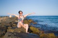 Holidays lifestyle portrait of young Asian woman by the  sea -  happy and beautiful Korean girl  enjoying beach vacation trip Royalty Free Stock Photo