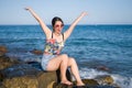 Holidays lifestyle portrait of young Asian woman by the  sea -  happy and beautiful Korean girl  enjoying beach vacation trip Royalty Free Stock Photo