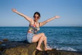 Holidays lifestyle portrait of young Asian woman by the  sea -  happy and beautiful Korean girl  enjoying beach vacation trip Royalty Free Stock Photo