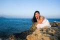 Holidays lifestyle portrait of young Asian woman by the  sea -  happy and beautiful Korean girl  enjoying beach vacation trip Royalty Free Stock Photo