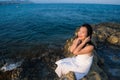 Holidays lifestyle portrait of young Asian woman by the  sea -  happy and beautiful Korean girl  enjoying beach vacation trip Royalty Free Stock Photo