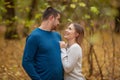 Holidays, love, tourism, relationship and dating concept - romantic couple kissing in the autumn park Royalty Free Stock Photo