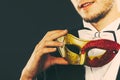 Young man in carnival mask on dark Royalty Free Stock Photo