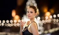 Young asian woman drinking champagne at christmas Royalty Free Stock Photo