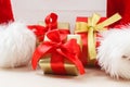 Small red and golden boxes with gifts tied bows Royalty Free Stock Photo