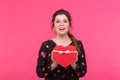 Holidays, present and surprise concept - Beauty happy girl with Valentine Gift box on pink background. Smiling surprised Royalty Free Stock Photo