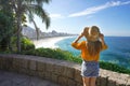 Holidays in Rio de Janeiro. Rear view of beautiful fashion girl looking at Rio de Janeiro amazing beaches of Leblon and Ipanema