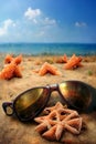 Holidays. sand beach, sunglasses and starfish