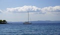 Holidays at sea. Pleasure yacht on the horizon. September in Greece. Sithonia.