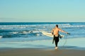 Papamoa Beach, Papamoa, New Zealand, July 07, 2019: an unidentified surfer preparing to enter the sea.