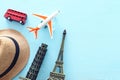 Holidays. Top view banner photo of traveling concept with accessories and world symbols over blue background