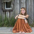 Holidays in the village. Girl teenager sitting near the house. Nature. Royalty Free Stock Photo