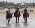 HOLKHAM, UNITED KINGDOM - Aug 09, 2016: Horse Riding on The Beach Royalty Free Stock Photo