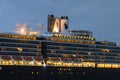 Holland America Line cruise ship Westerdam with lights at dawn Royalty Free Stock Photo