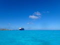 The Holland America Line Zuiderdam cruise ship anchored off the private island of Half Moon Cay in the Bahamas on a sunny day with Royalty Free Stock Photo