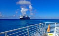 The Holland America Line Zuiderdam cruise ship anchored off the private island of Half Moon Cay in the Bahamas on a sunny day with Royalty Free Stock Photo