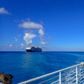 The Holland America Line Zuiderdam cruise ship anchored off the private island of Half Moon Cay in the Bahamas on a sunny day with Royalty Free Stock Photo