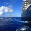 The Holland America Line Zuiderdam cruise ship anchored off the private island of Half Moon Cay in the Bahamas on a sunny day with Royalty Free Stock Photo