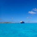 The Holland America Line Zuiderdam cruise ship anchored off the private island of Half Moon Cay in the Bahamas on a sunny day with Royalty Free Stock Photo