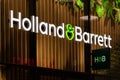 Holland and Barrett logo on the front shop.