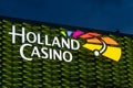 Holland Casino Utrecht illuminated logo on illuminated building.