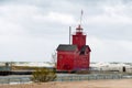 Red Michigan lighthouse in windstorm