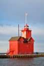 Holland Harbor Light Big Red lighthouse on lake Michigan MI against morning sky Royalty Free Stock Photo