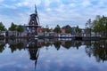 Holland - Meppel - a windmill in the middle of the town of Meppel, standing on the edge of a canal. The mill stands between the