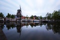 Holland - Meppel - a windmill in the middle of the town of Meppel, standing on the edge of a canal. The mill stands between