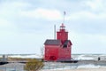 Red Michigan lighthouse with storm waves Royalty Free Stock Photo
