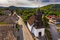 Holloko, Hungary - Aerial view of the traditional catholic church of Holloko at the village centre, an UNESCO site in Hungary Royalty Free Stock Photo