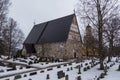 View of the medieval, stone Church, Hollolan Kirkko, with cemetery, Hollola, Finland.