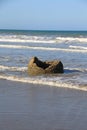 A hollow Moeraki Boulder at the beach Royalty Free Stock Photo