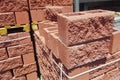 Hollow red spliter blocks bricks stacked on pallets for sale Royalty Free Stock Photo