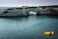 Hollowed-out limestone arch, S`Archittu di Santa Caterina, Sardinia, Italy Royalty Free Stock Photo